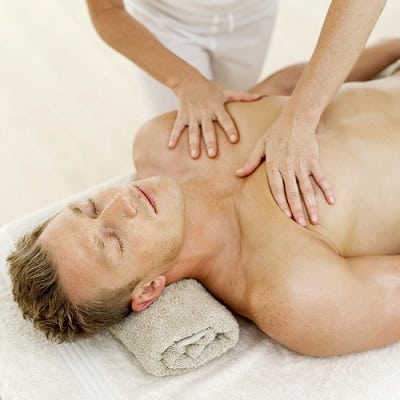 Man getting a chest massage from a woman