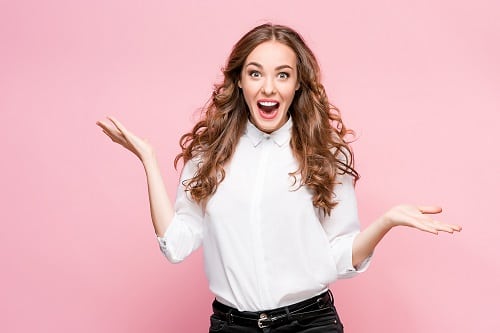 Surprised happy beautiful woman looking in excitement