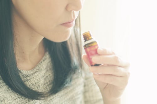 Woman smelling the essential oil