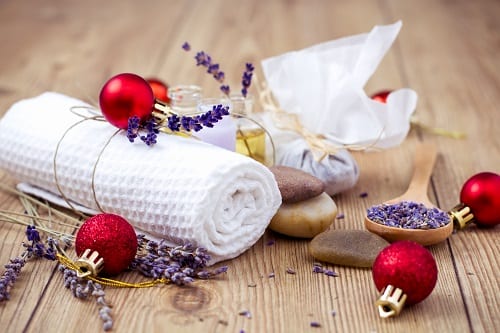 Holiday spa treatment with lavender, rocks, and a towel