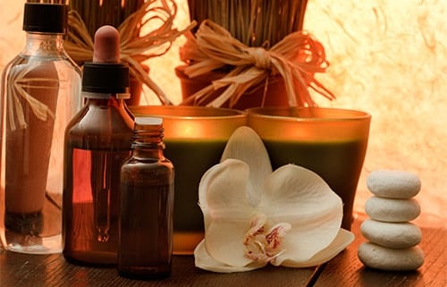 Essential oil, aromatherapy candles and flowers